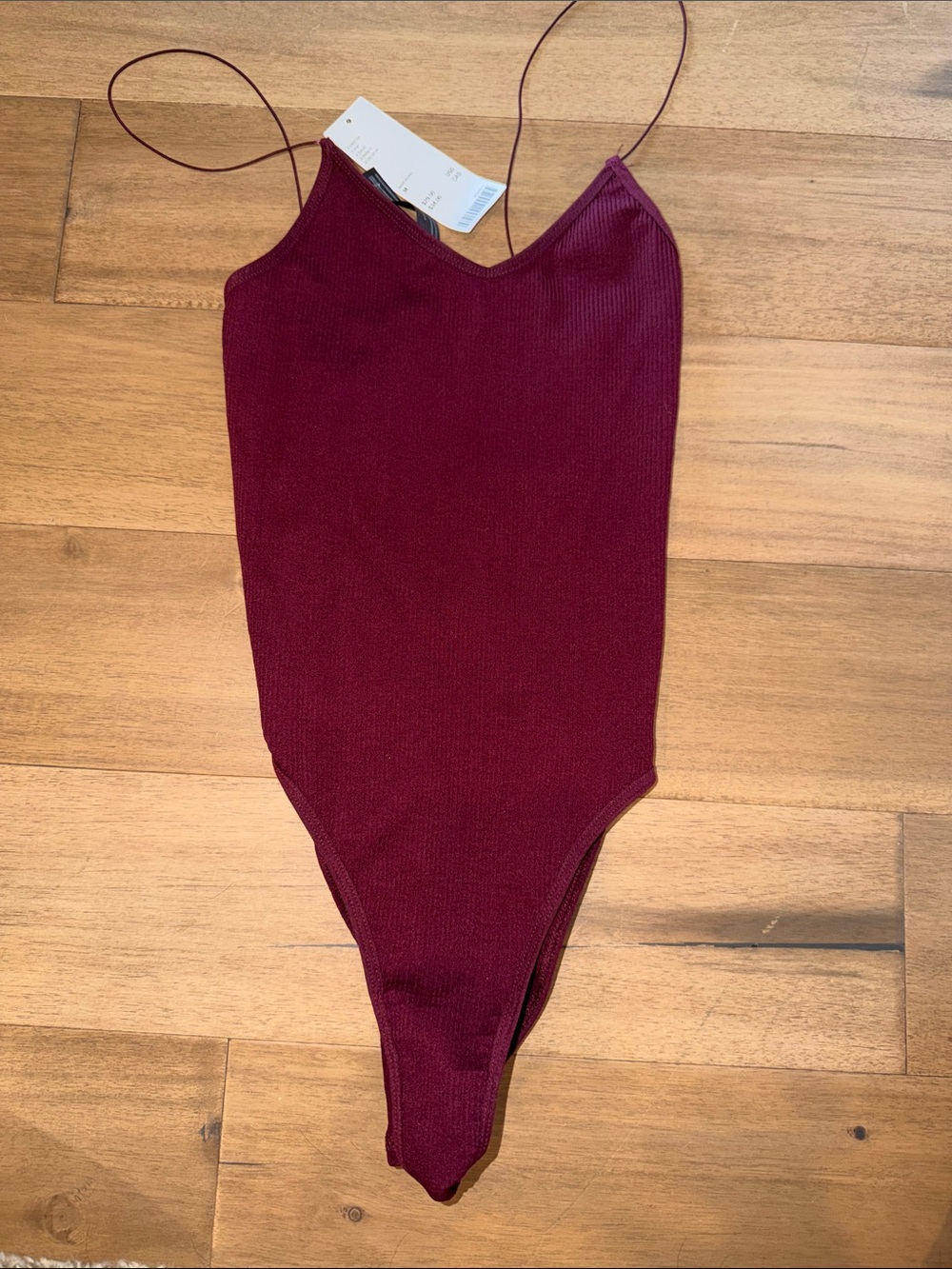Womens urban out fitters M
Ribbed One-Piece body suit in Burgundy